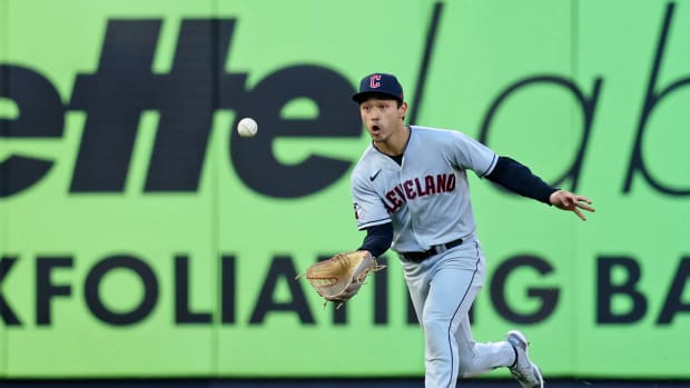 Steven Kwan makes a running, basket-style catch in left field.